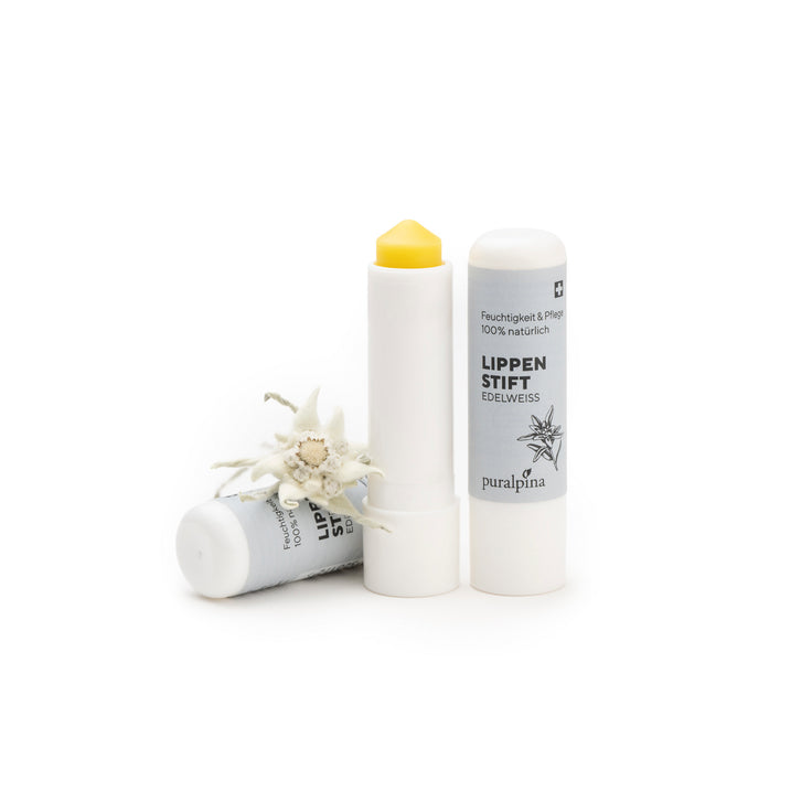 Puralpina Lippenstift Edelweiss, geöffnet mit sichtbarem Pflegestift und Edelweissblüte
