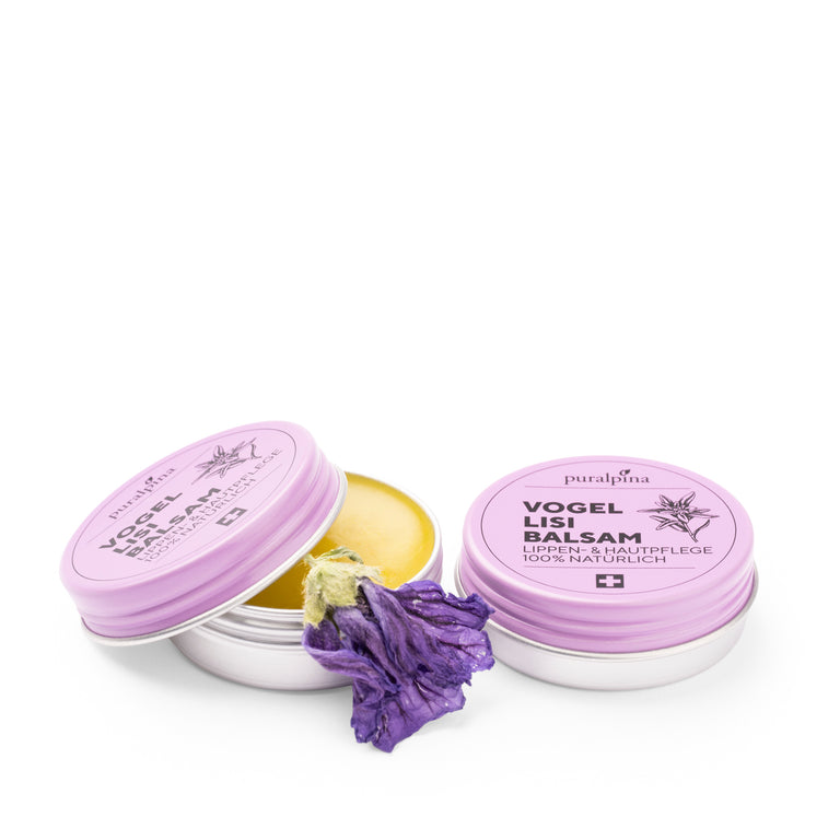 Geöffnete und geschlossene Dose puralpina Vogellisi Balsam mit violetter Blüte