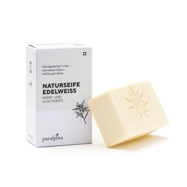 Puralpina Naturseife Edelweiss mit weisser Kartonverpackung und Seifenstück mit Edelweiss Prägung